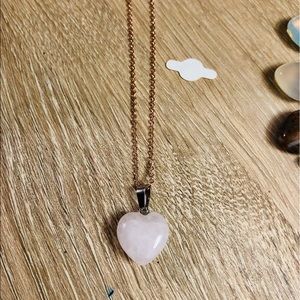 Rose quart stone with rose gold necklace.
